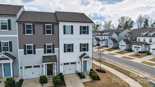 a front view of a house with parking space