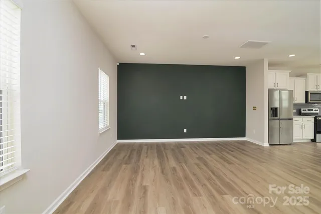 a view of an entryway with wooden floor and stairs
