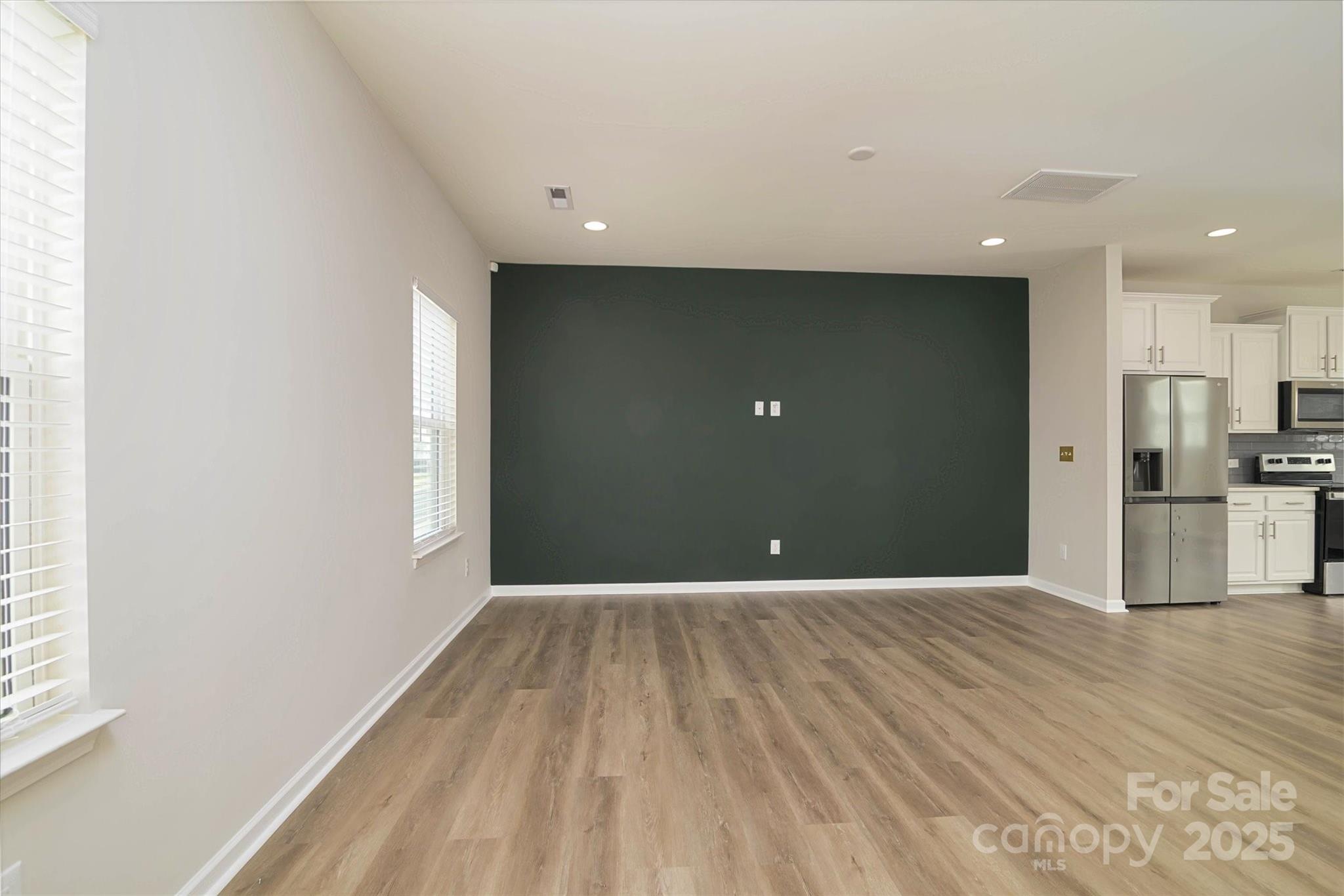 13304 Porter Creek Road Charlotte, NC 28262 - Photo 10 of 22 a view of a livingroom with wooden floor