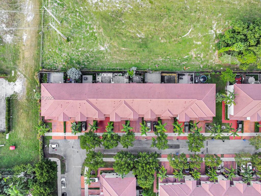 1007 Northeast 208th Street, Unit 1007 Miami, FL 33179 - Photo 11 of 68 an aerial view of house with swimming pool outdoor seating and yard