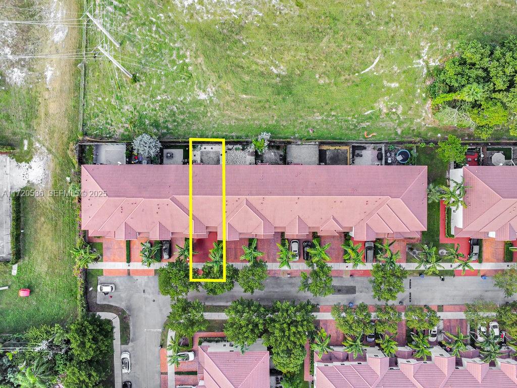 1007 Northeast 208th Street, Unit 1007 Miami, FL 33179 - Photo 12 of 68 an aerial view of house with swimming pool outdoor seating and yard