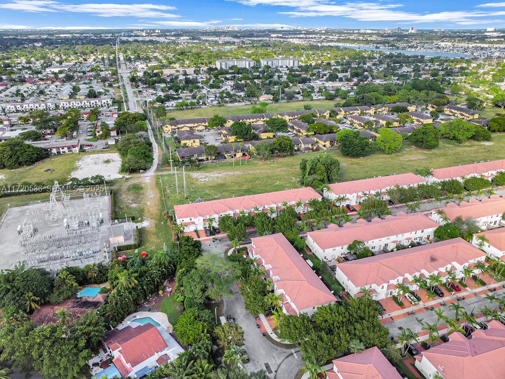 1007 Northeast 208th Street, Unit 1007 Miami, FL 33179 - Photo 13 of 68 an aerial view of residential houses with outdoor space