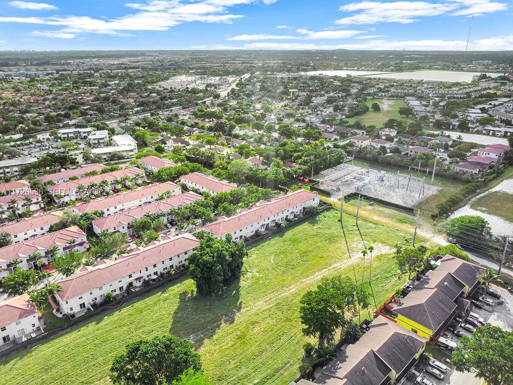 1007 Northeast 208th Street, Unit 1007 Miami, FL 33179 - Photo 17 of 68 an aerial view of residential houses with outdoor space