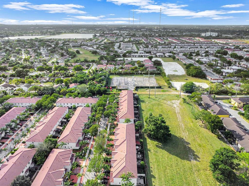1007 Northeast 208th Street, Unit 1007 Miami, FL 33179 - Photo 18 of 68 an aerial view of residential houses with outdoor space