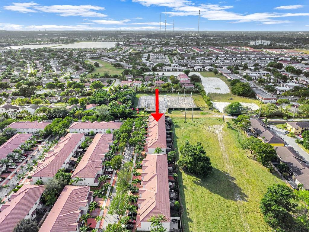 1007 Northeast 208th Street, Unit 1007 Miami, FL 33179 - Photo 19 of 68 an aerial view of residential houses with outdoor space