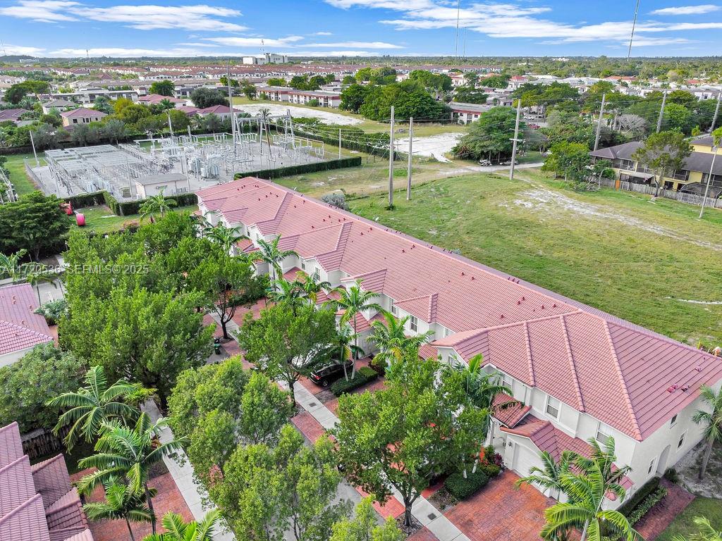 1007 Northeast 208th Street, Unit 1007 Miami, FL 33179 - Photo 29 of 68 a view of a garden with an ocean