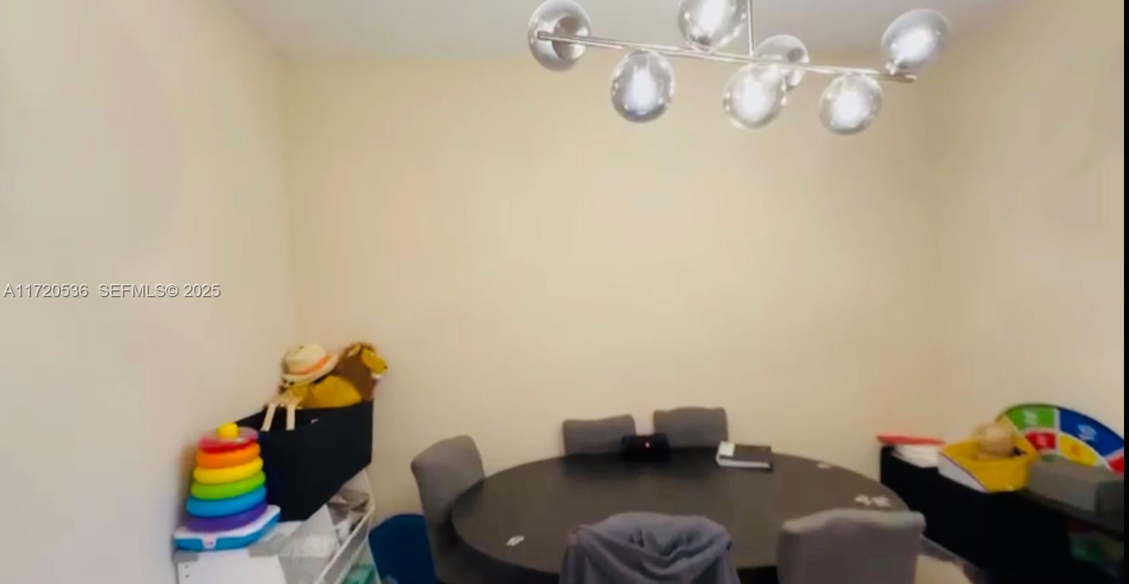 1007 Northeast 208th Street, Unit 1007 Miami, FL 33179 - Photo 40 of 68 a view of a workspace with a couch