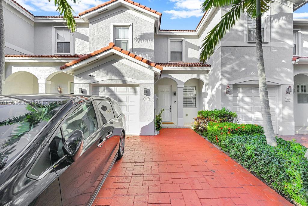 1007 Northeast 208th Street, Unit 1007 Miami, FL 33179 - Photo 5 of 68 a view of a house with a patio