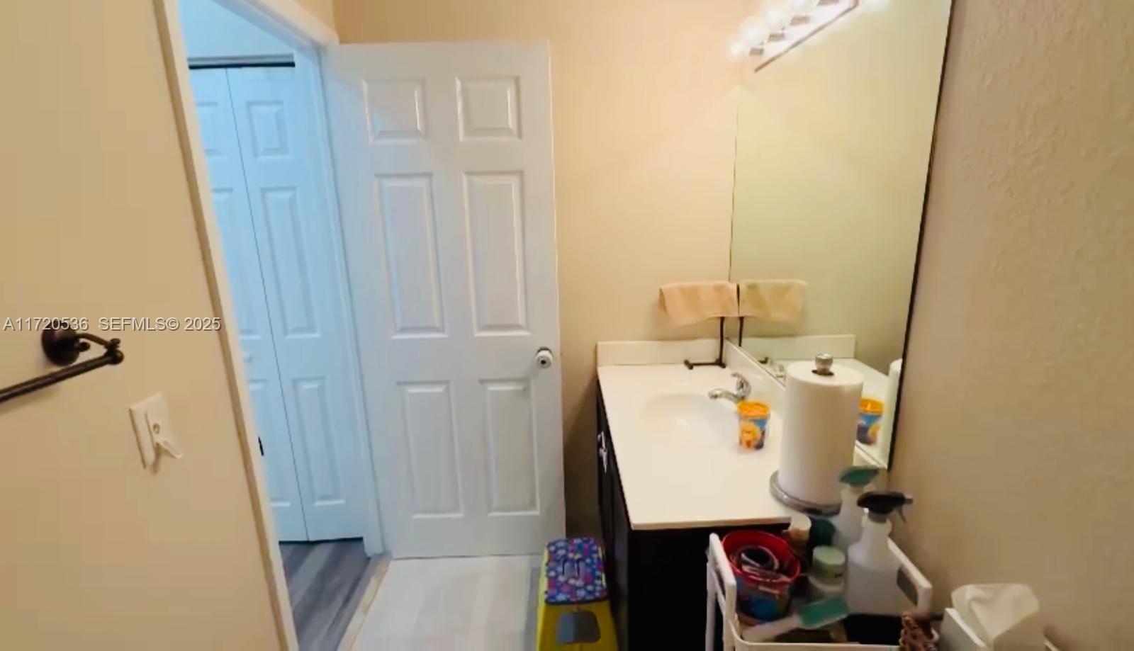 1007 Northeast 208th Street, Unit 1007 Miami, FL 33179 - Photo 52 of 68 a utility room with dryer and washer
