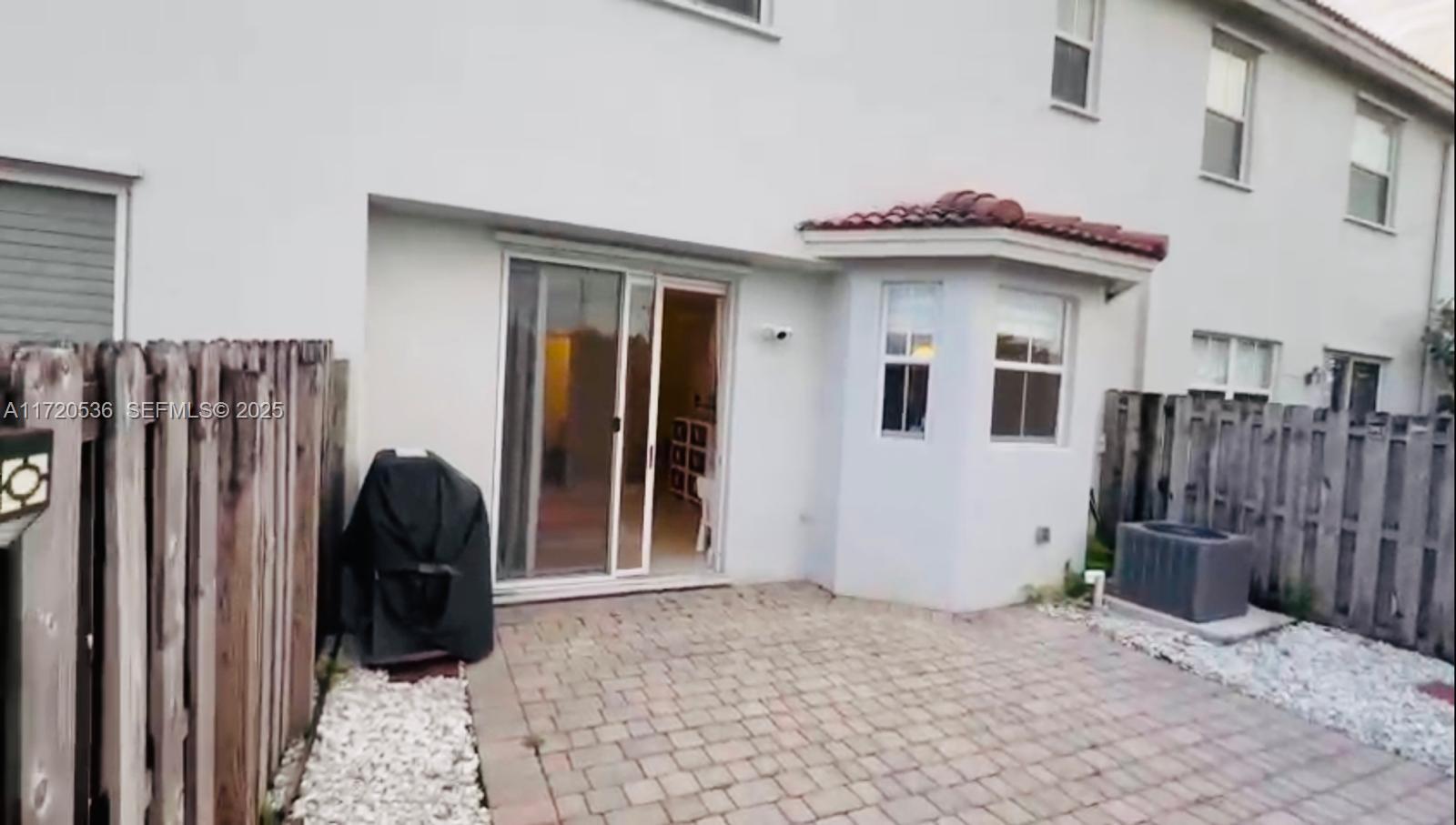 1007 Northeast 208th Street, Unit 1007 Miami, FL 33179 - Photo 66 of 68 a view of a entryway door of the house