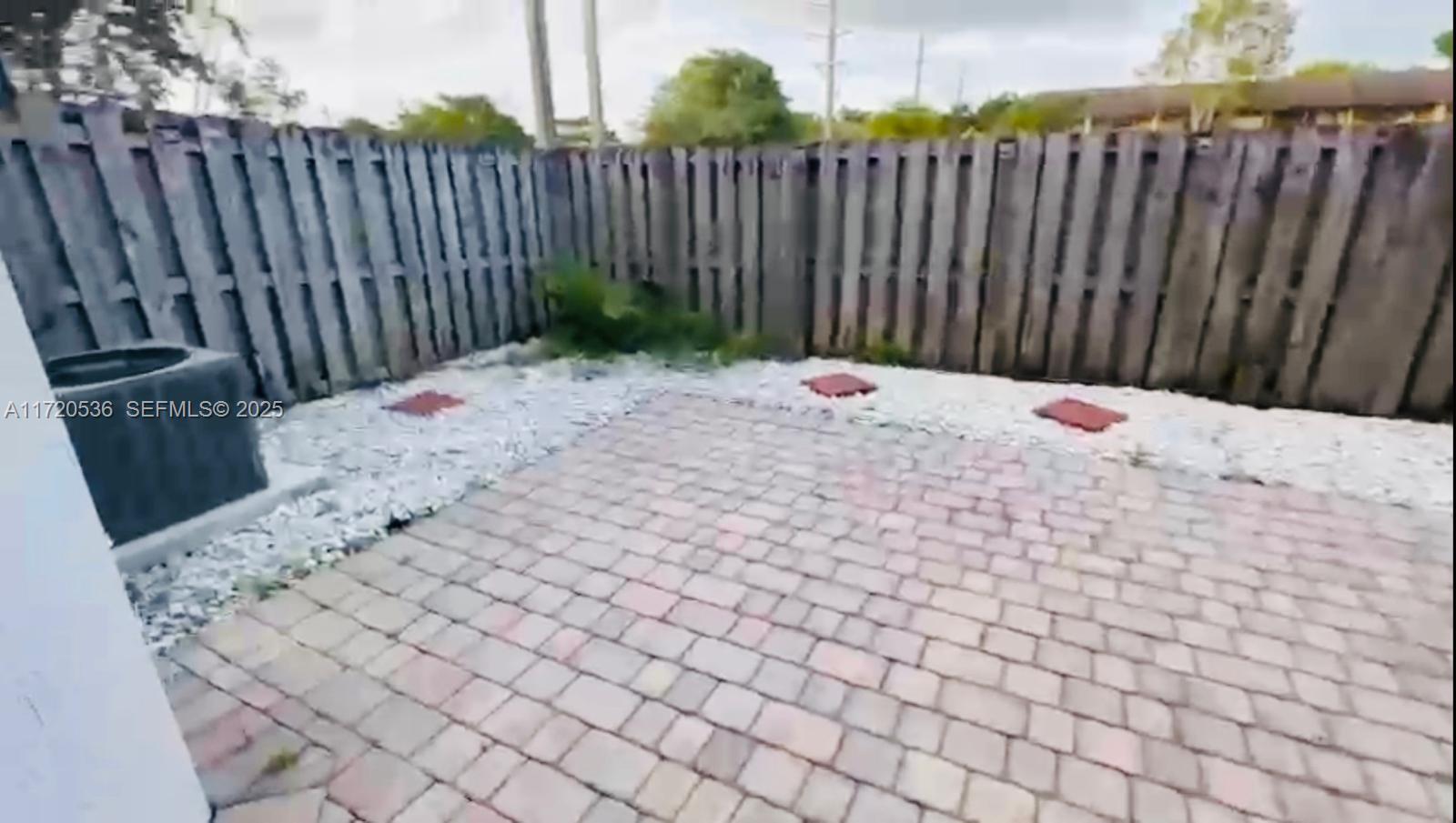 1007 Northeast 208th Street, Unit 1007 Miami, FL 33179 - Photo 67 of 68 a view of wooden fence