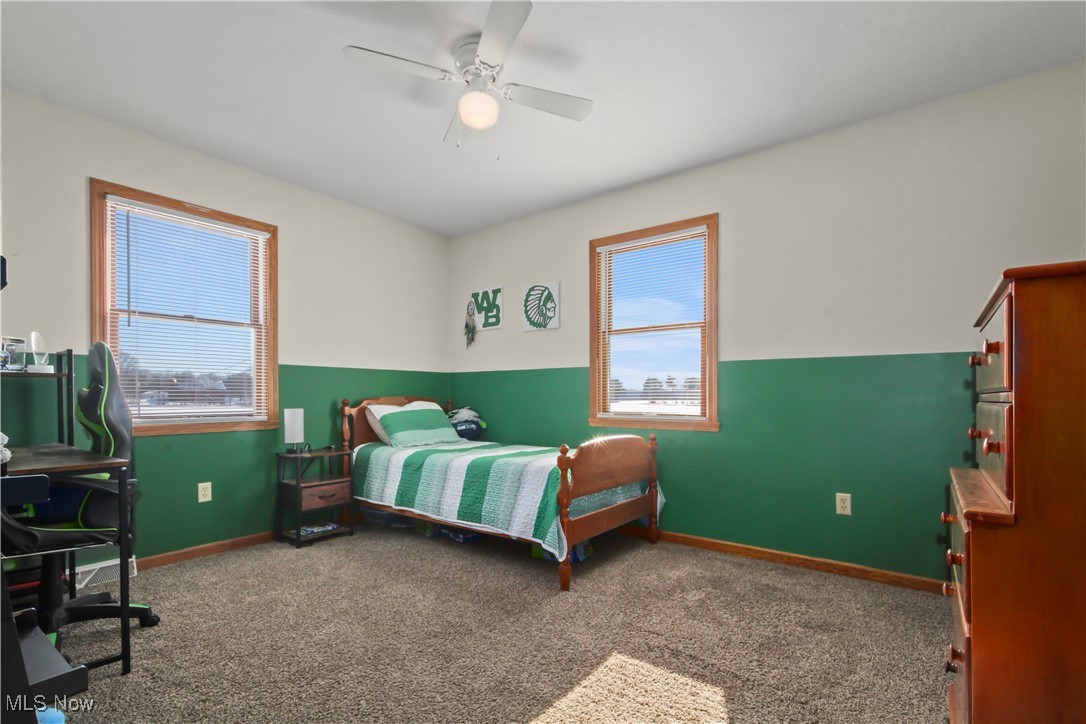 28196 Hartley Road Beloit, OH 44609 - Photo 19 of 27 Bedroom featuring ceiling fan and carpet floors