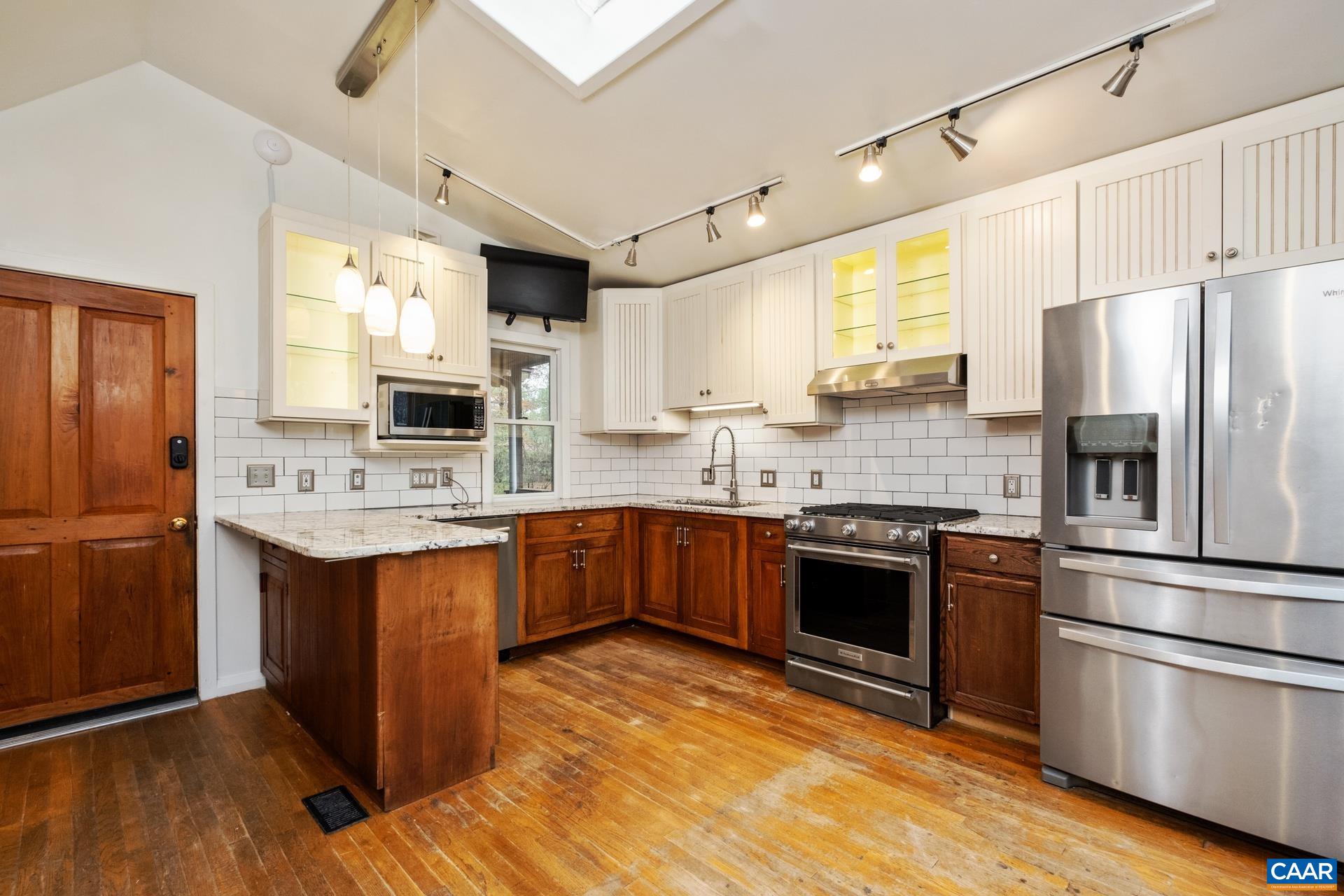 122 Seville Road Rochelle, VA 22738 - Photo 11 of 40 a kitchen with stainless steel appliances kitchen island granite countertop a refrigerator stove and sink