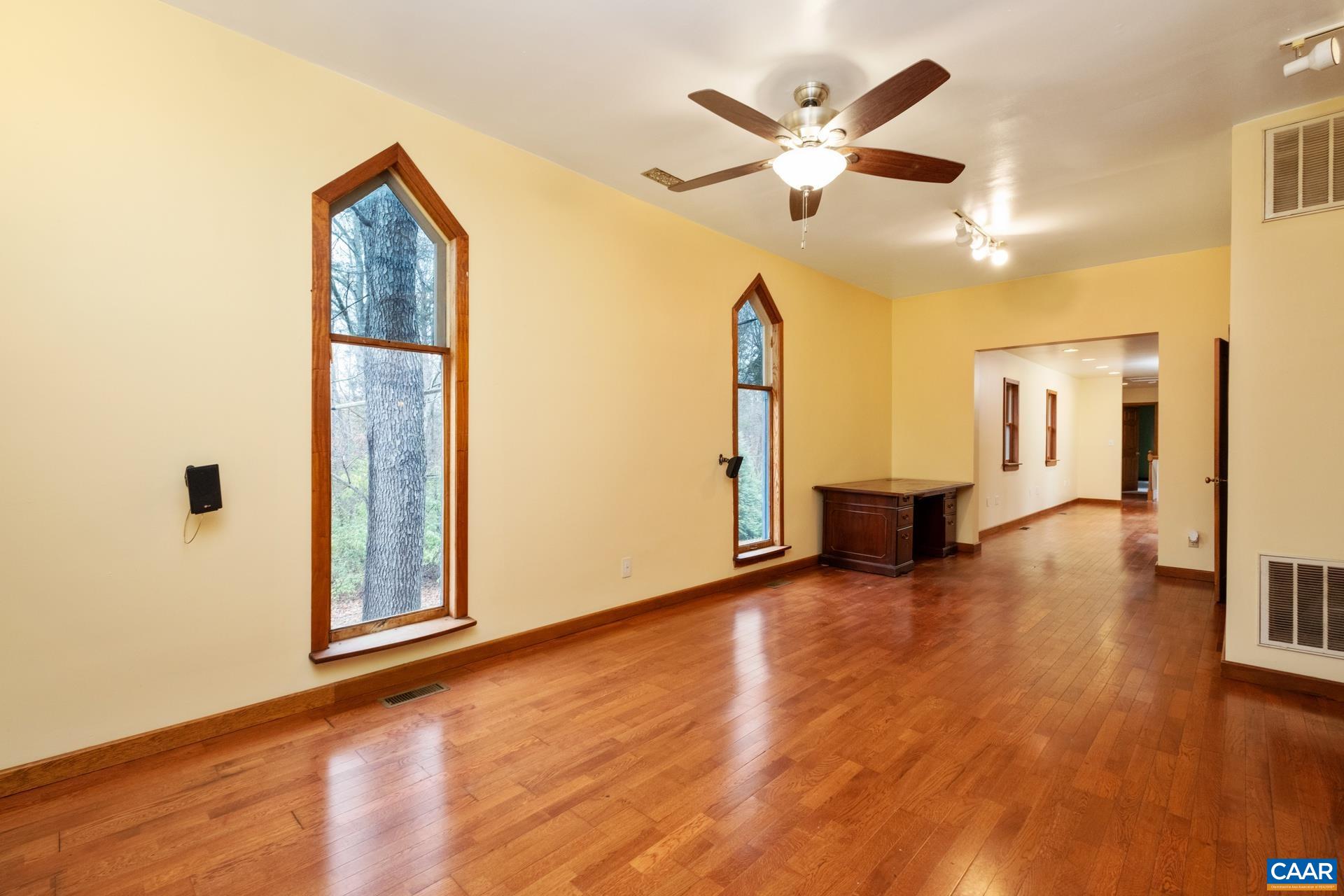 122 Seville Road Rochelle, VA 22738 - Photo 9 of 40 a view of an empty room with window and wooden floor