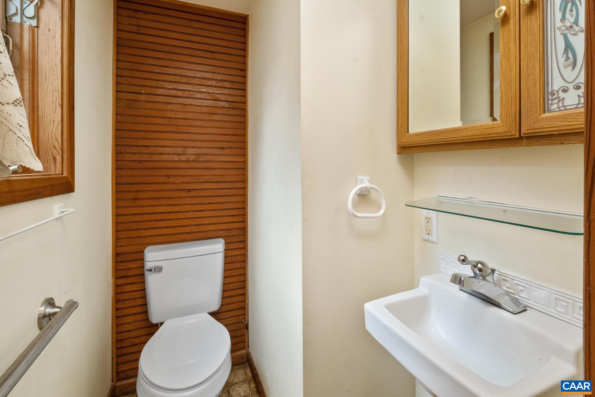 122 Seville Road Rochelle, VA 22738 - Photo 10 of 40 a white toilet sitting next to a bathroom sink