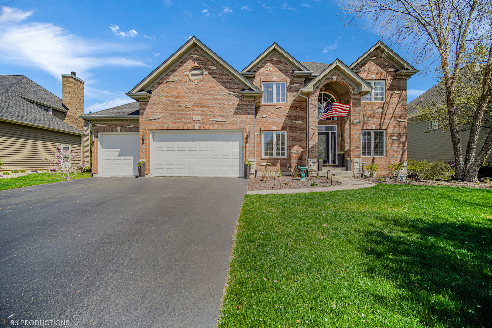 707 Merrill New Road Sugar Grove, IL 60554 - Photo 1 of 33 a front view of a house with garden