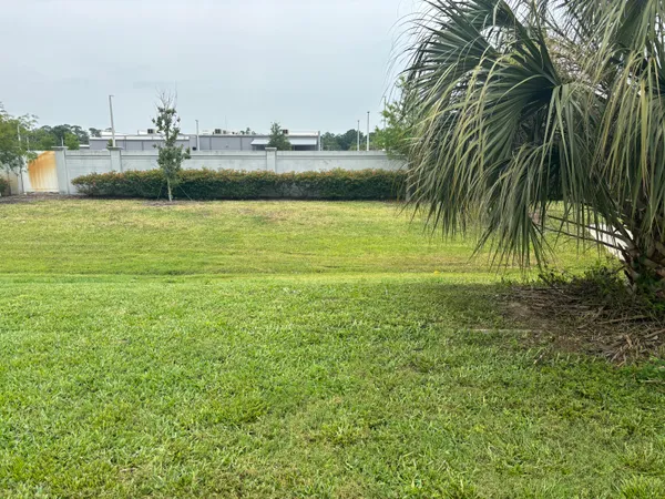 a view of a swimming pool with a yard