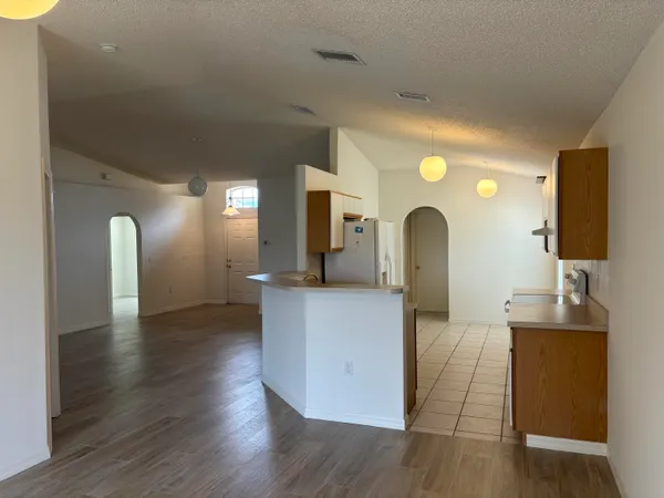 a living room with furniture and a mirror