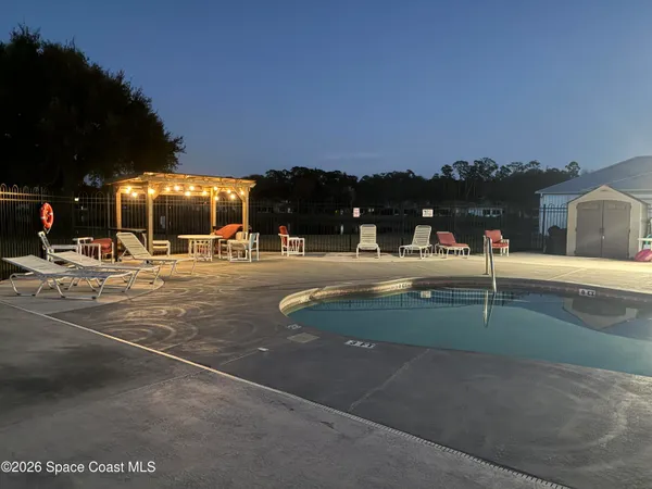 a view of a lake with houses in the background
