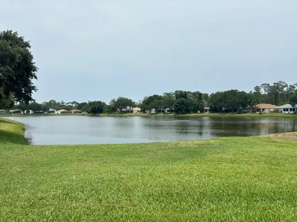 a sign that is on a wooden bench