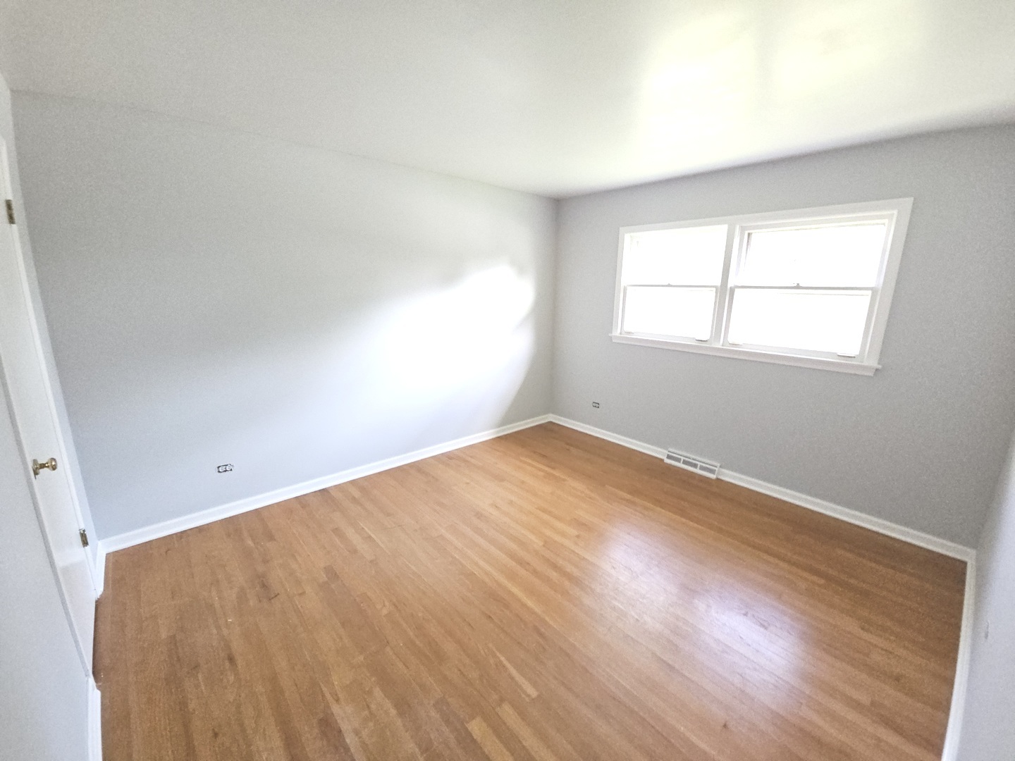 827 Balmoral Drive East Dundee, IL 60118 - Photo 13 of 16 an empty room with wooden floor and windows