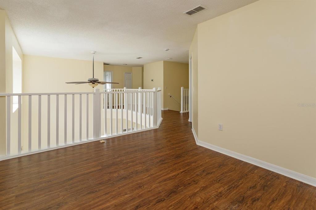 2833 Kokomo Loop Haines City, FL 33844 - Photo 15 of 30 a view of a hallway with wooden floor