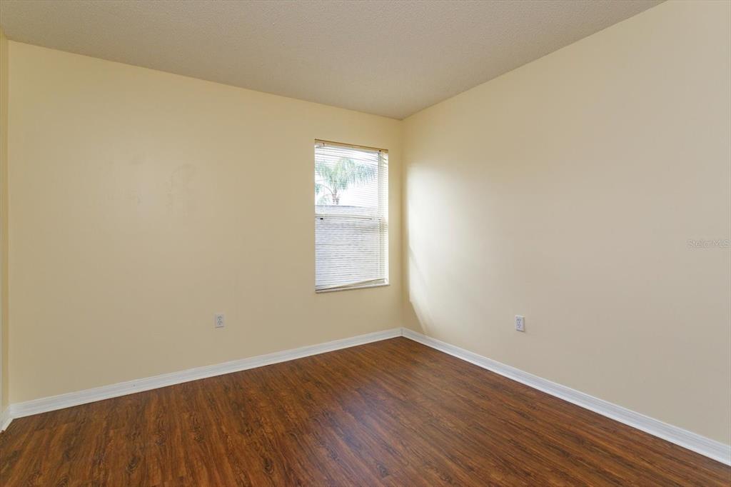2833 Kokomo Loop Haines City, FL 33844 - Photo 22 of 30 wooden floor in an empty room
