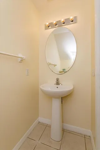 a bathroom with a sink and mirror