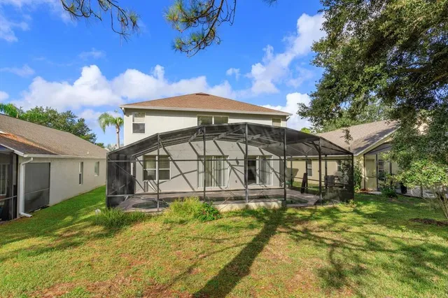 a front view of a house with a yard table and chairs