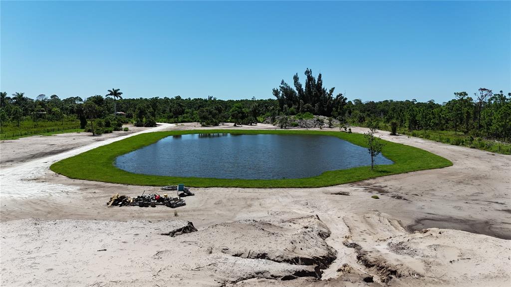 6455 Stringfellow Road St. James City, FL 33956 - Photo 11 of 33 a view of a swimming pool with a yard