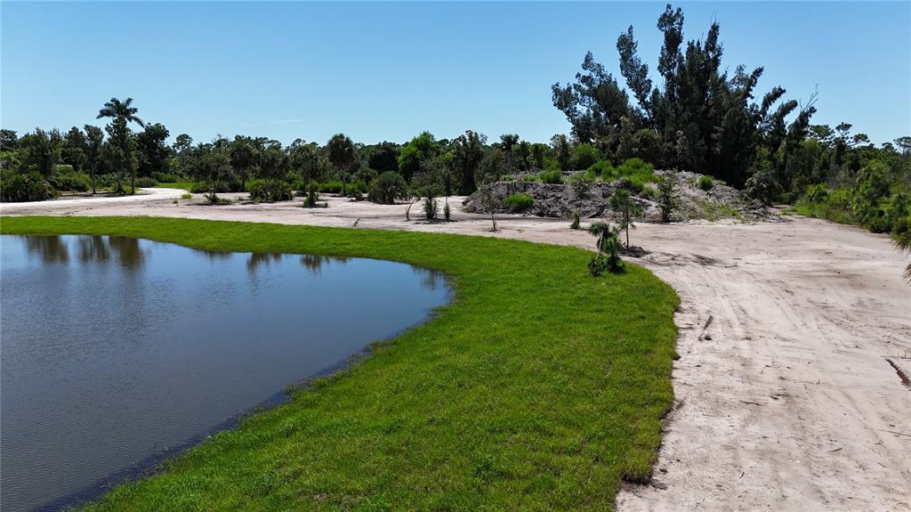 6455 Stringfellow Road St. James City, FL 33956 - Photo 13 of 33 a view of a lake with outdoor space