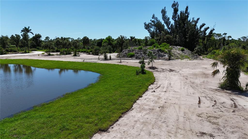 6455 Stringfellow Road St. James City, FL 33956 - Photo 16 of 33 a view of a lake with a park