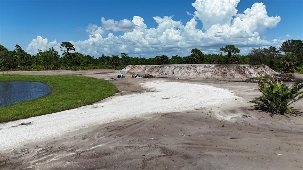 6455 Stringfellow Road St. James City, FL 33956 - Photo 17 of 33 a view of a yard with wooden fence