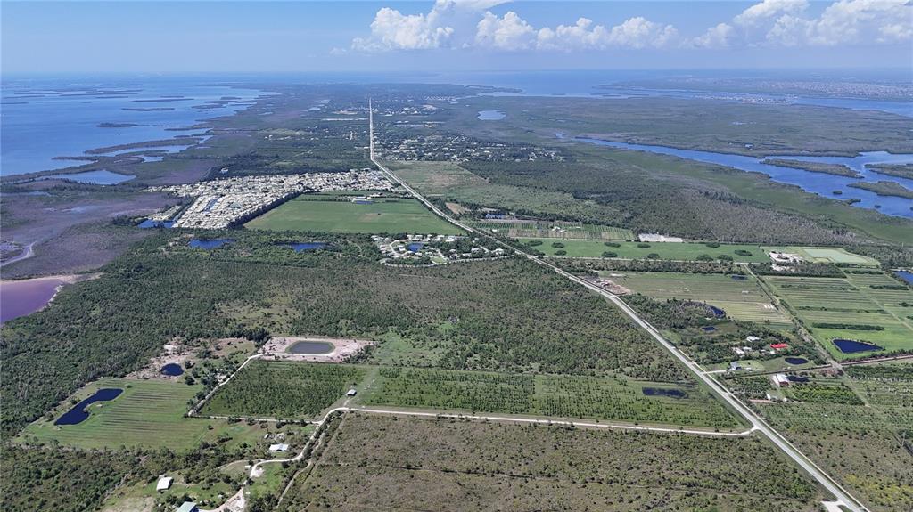 6455 Stringfellow Road St. James City, FL 33956 - Photo 25 of 33 an aerial view of a residential houses with outdoor space