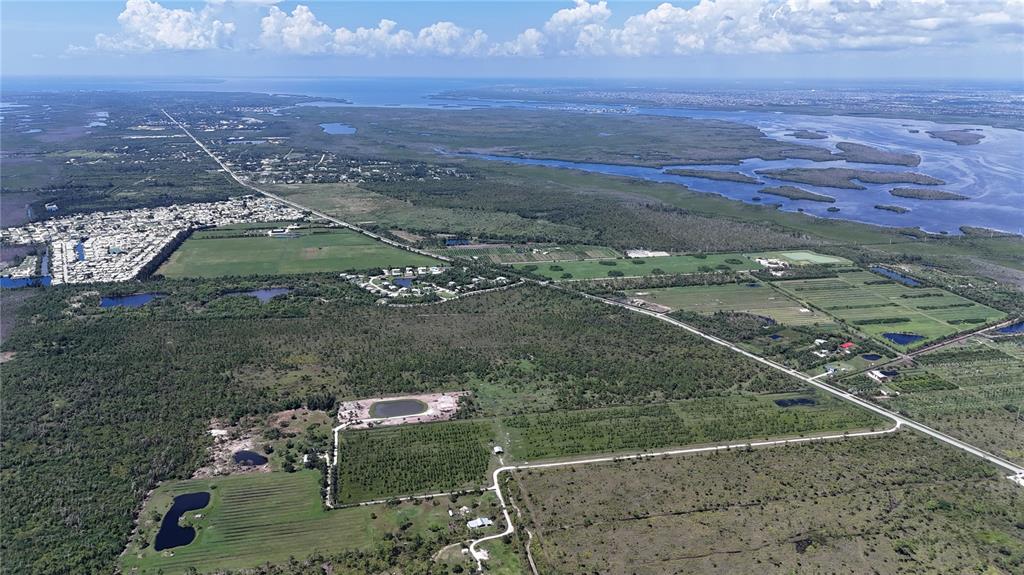 6455 Stringfellow Road St. James City, FL 33956 - Photo 26 of 33 an aerial view of residential houses with outdoor space