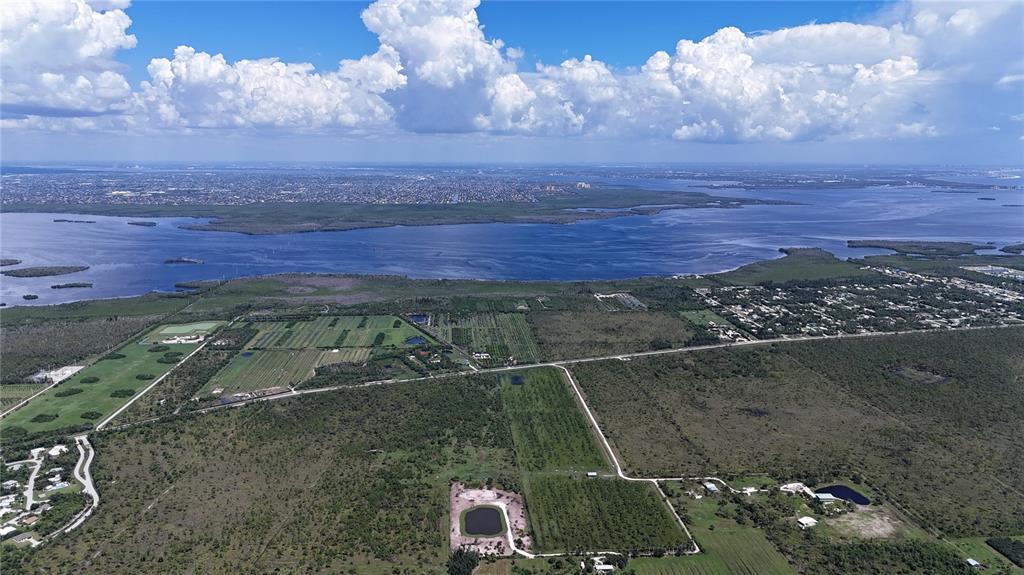 6455 Stringfellow Road St. James City, FL 33956 - Photo 28 of 33 an aerial view of a house with a yard