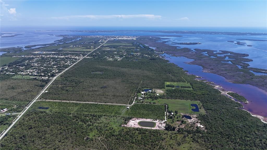 6455 Stringfellow Road St. James City, FL 33956 - Photo 30 of 33 an aerial view of a house with a yard