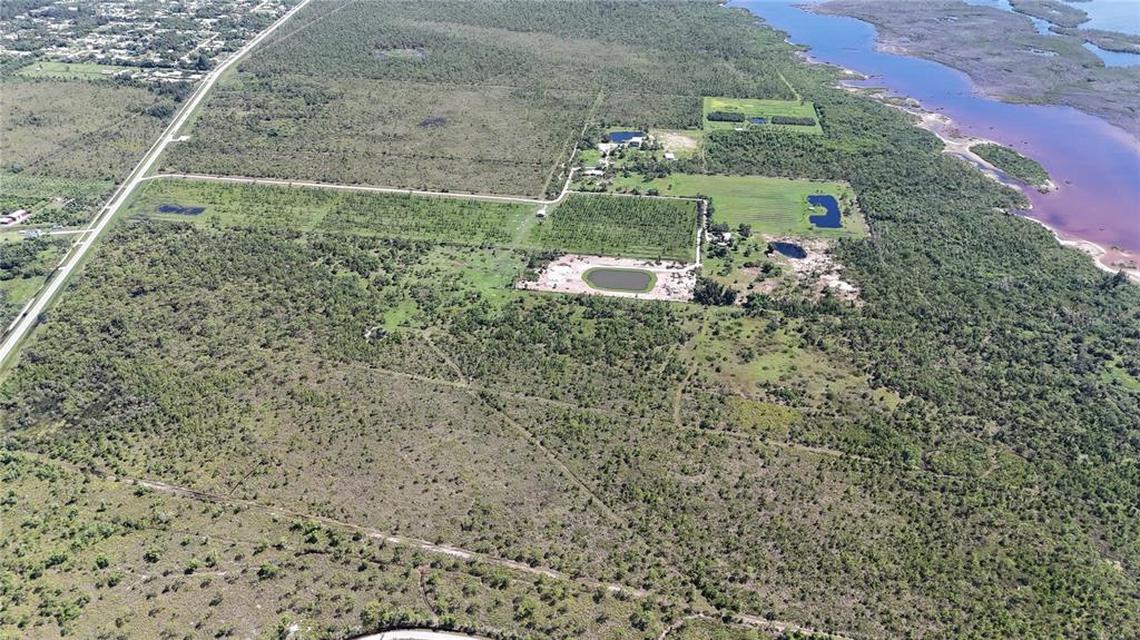 6455 Stringfellow Road St. James City, FL 33956 - Photo 31 of 33 a aerial view of a house with a yard
