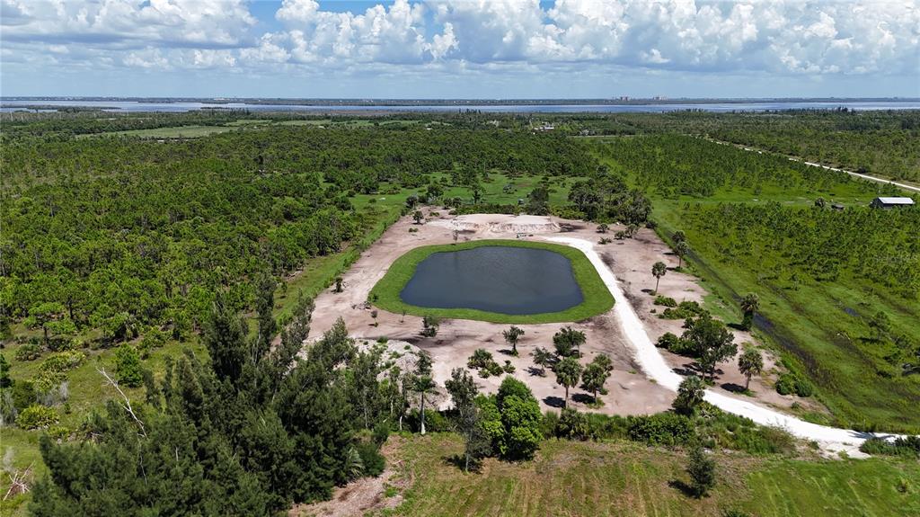 6455 Stringfellow Road St. James City, FL 33956 - Photo 4 of 33 a aerial view of a house with a yard