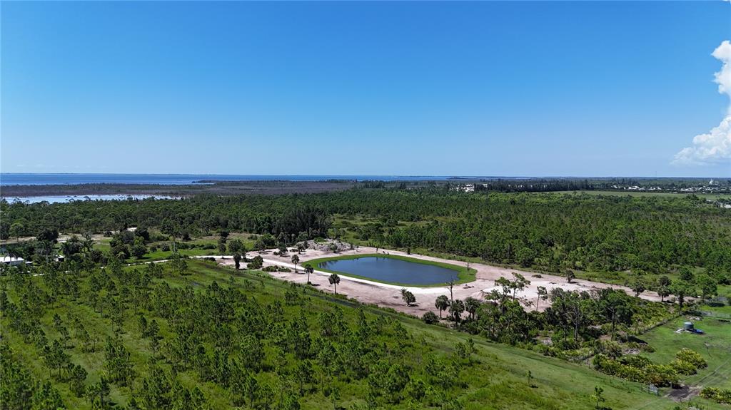 6455 Stringfellow Road St. James City, FL 33956 - Photo 9 of 33 a view of a lake with outdoor space