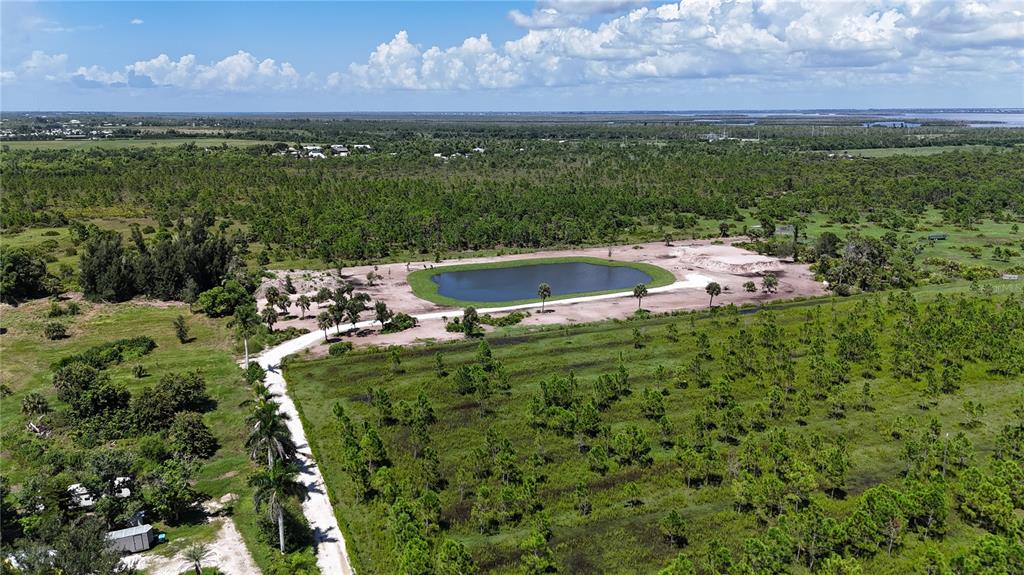 6455 Stringfellow Road St. James City, FL 33956 - Photo 10 of 33 a view of a lake from a yard