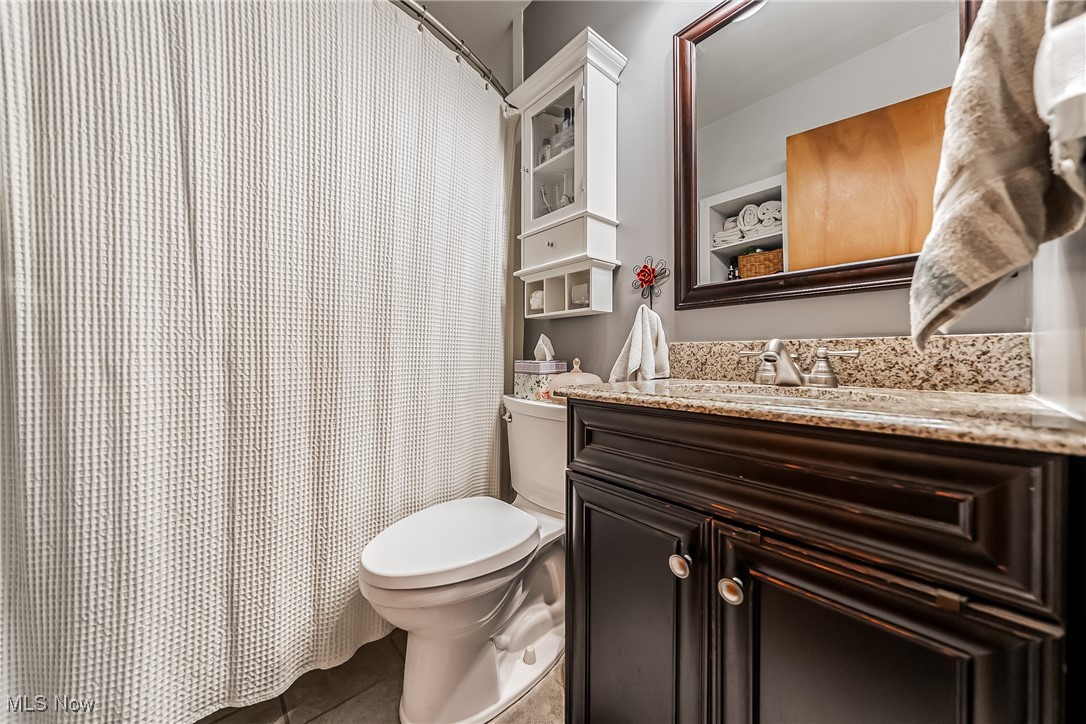 6287 Highland Road Cleveland, OH 44143 - Photo 13 of 46 Bathroom featuring toilet, vanity, and tile patterned flooring