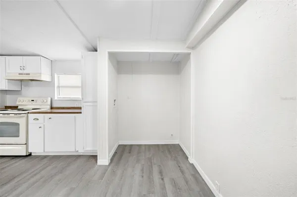 a view of kitchen with wooden floor