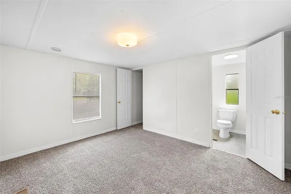 a view of empty room with toilet