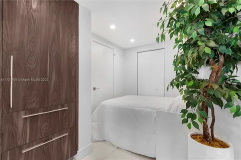 a bathroom with a glass shower door and a sink