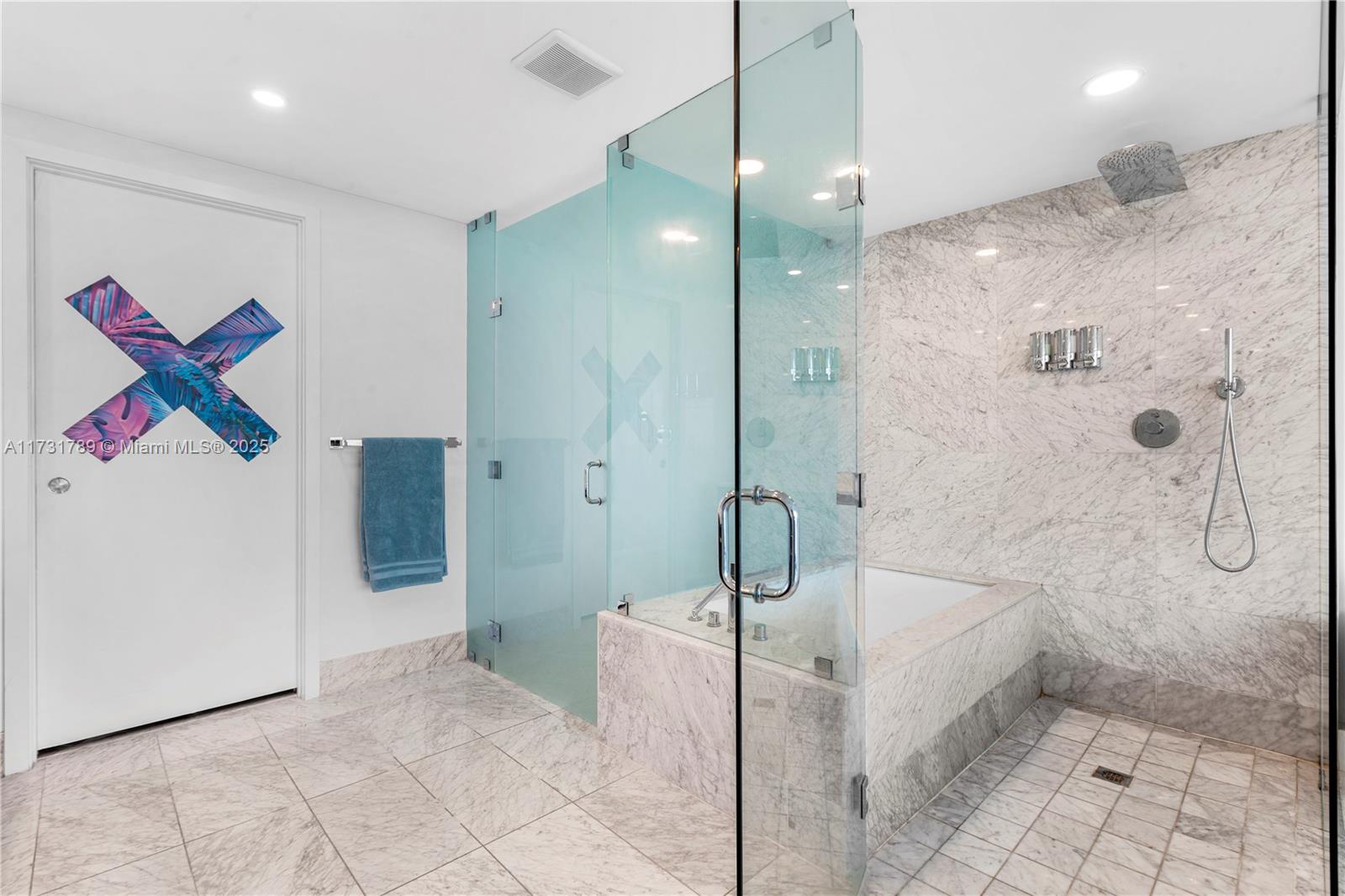 3131 Northeast 7th Avenue, Unit 1902 Miami, FL 33137 - Photo 12 of 20 a bathroom with a glass shower door and a sink