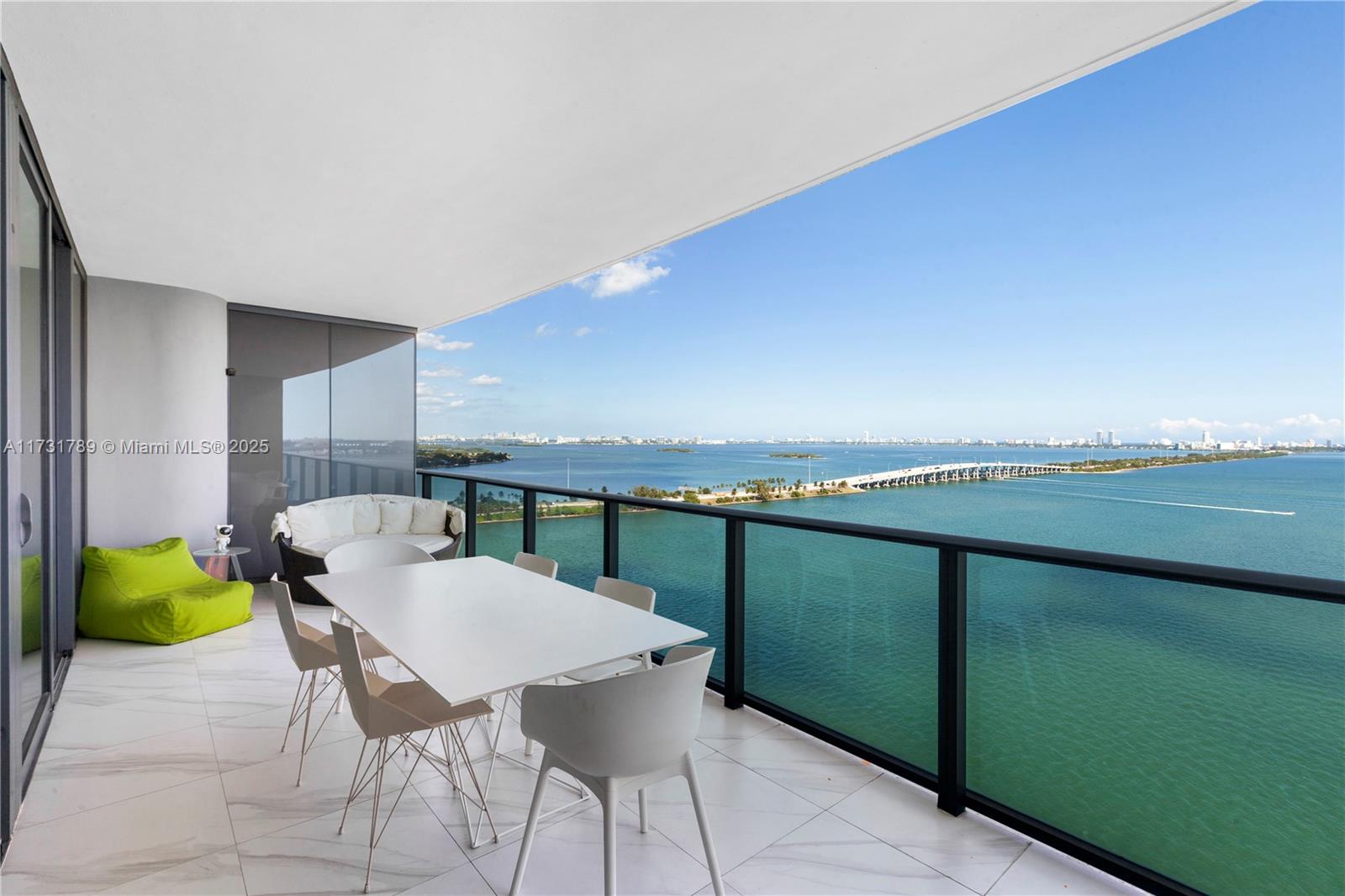 3131 Northeast 7th Avenue, Unit 1902 Miami, FL 33137 - Photo 17 of 20 a view of a chairs and table in patio