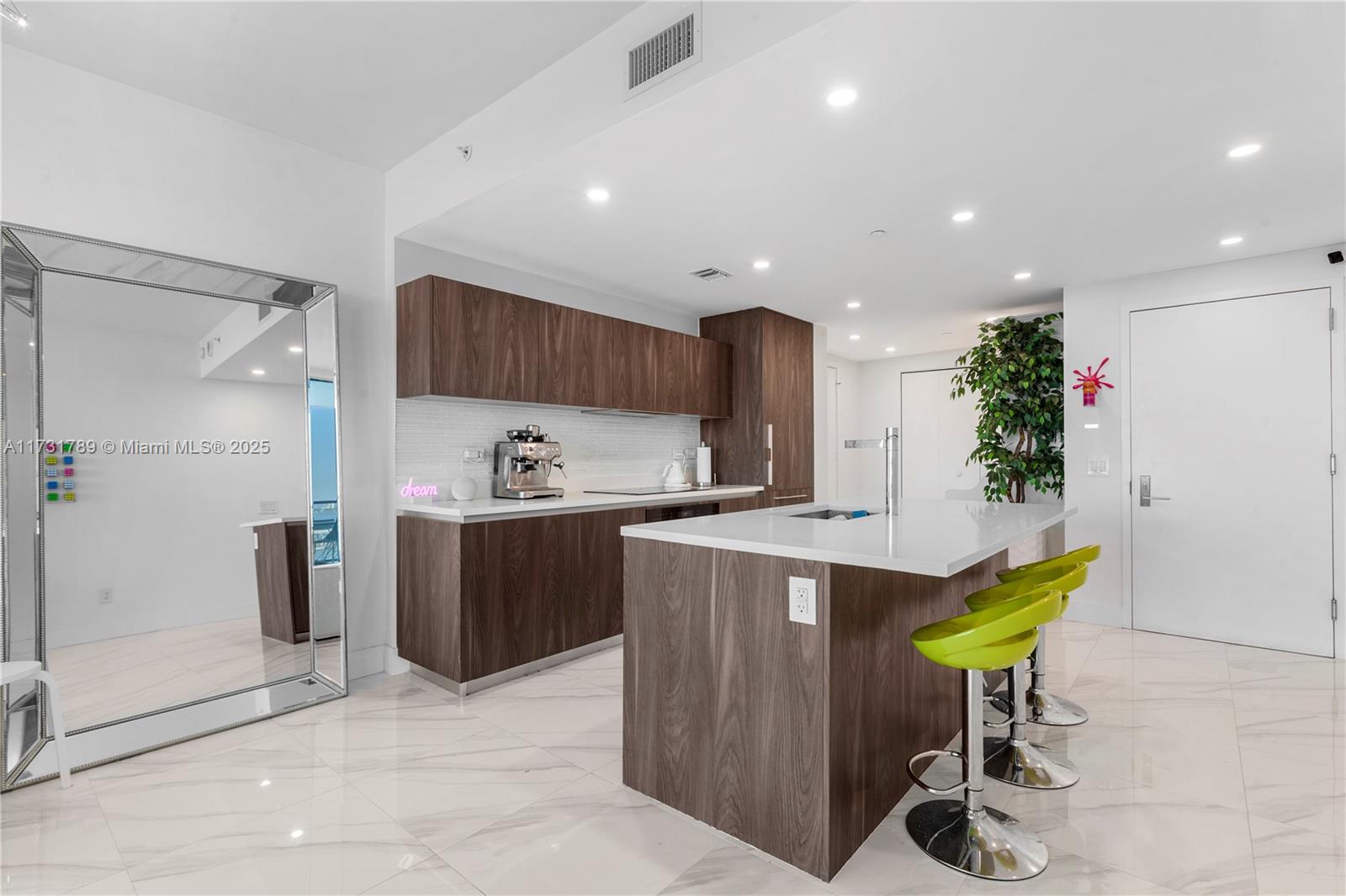 3131 Northeast 7th Avenue, Unit 1902 Miami, FL 33137 - Photo 20 of 20 a kitchen with stainless steel appliances granite countertop a refrigerator and a sink