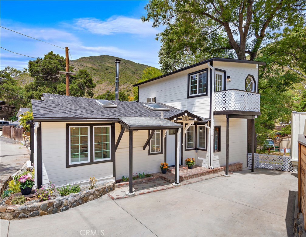 29229 Hazel Bell Drive Silverado, CA 92676 - Photo 1 of 39 a front view of a house with garden