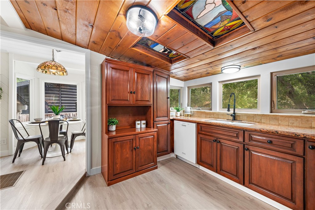 29229 Hazel Bell Drive Silverado, CA 92676 - Photo 11 of 39 a kitchen with granite countertop lots of counter top space and wooden floor